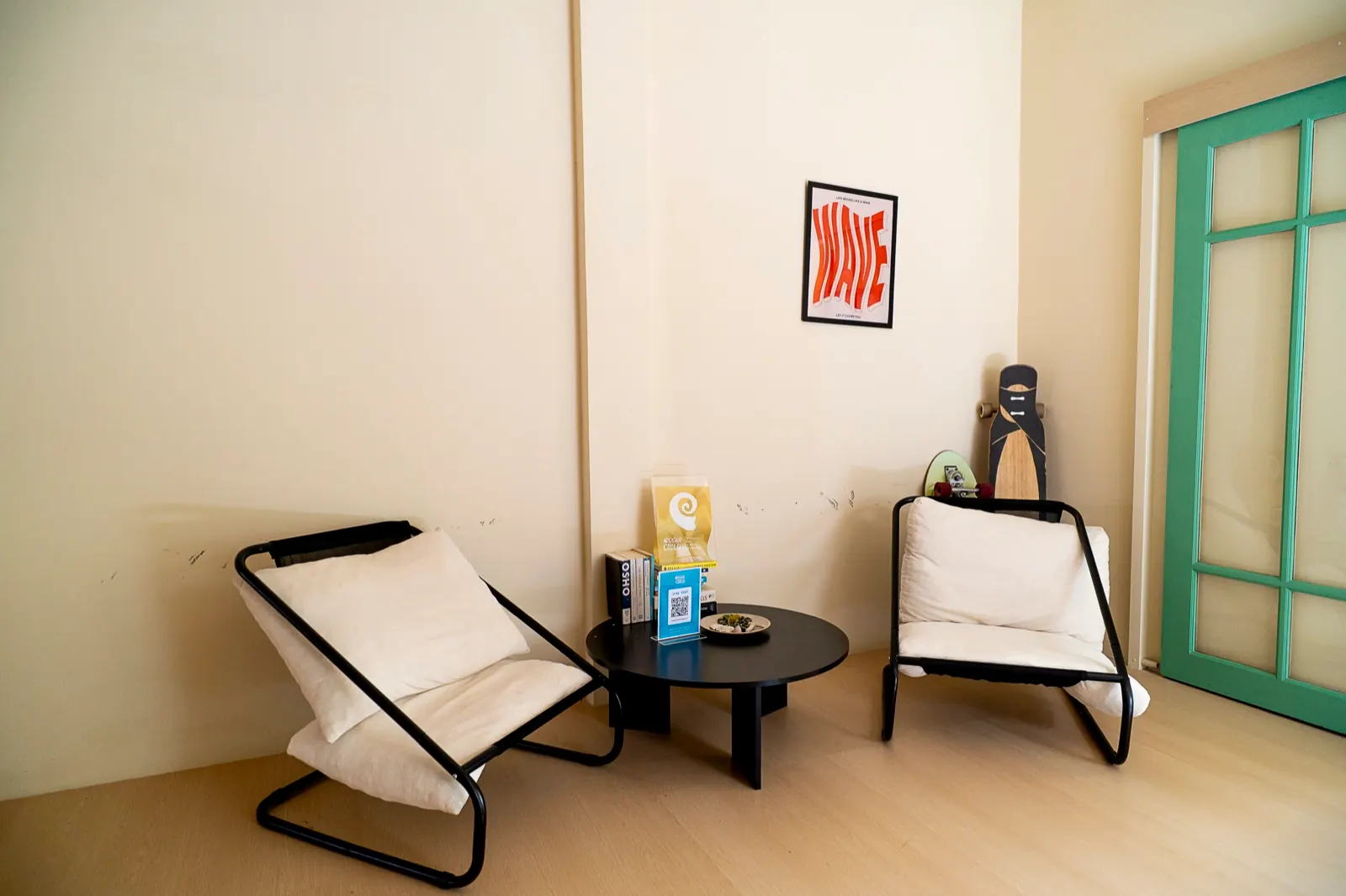 Relaxing Oceanchild lounge with books, skateboards, and comfortable seating