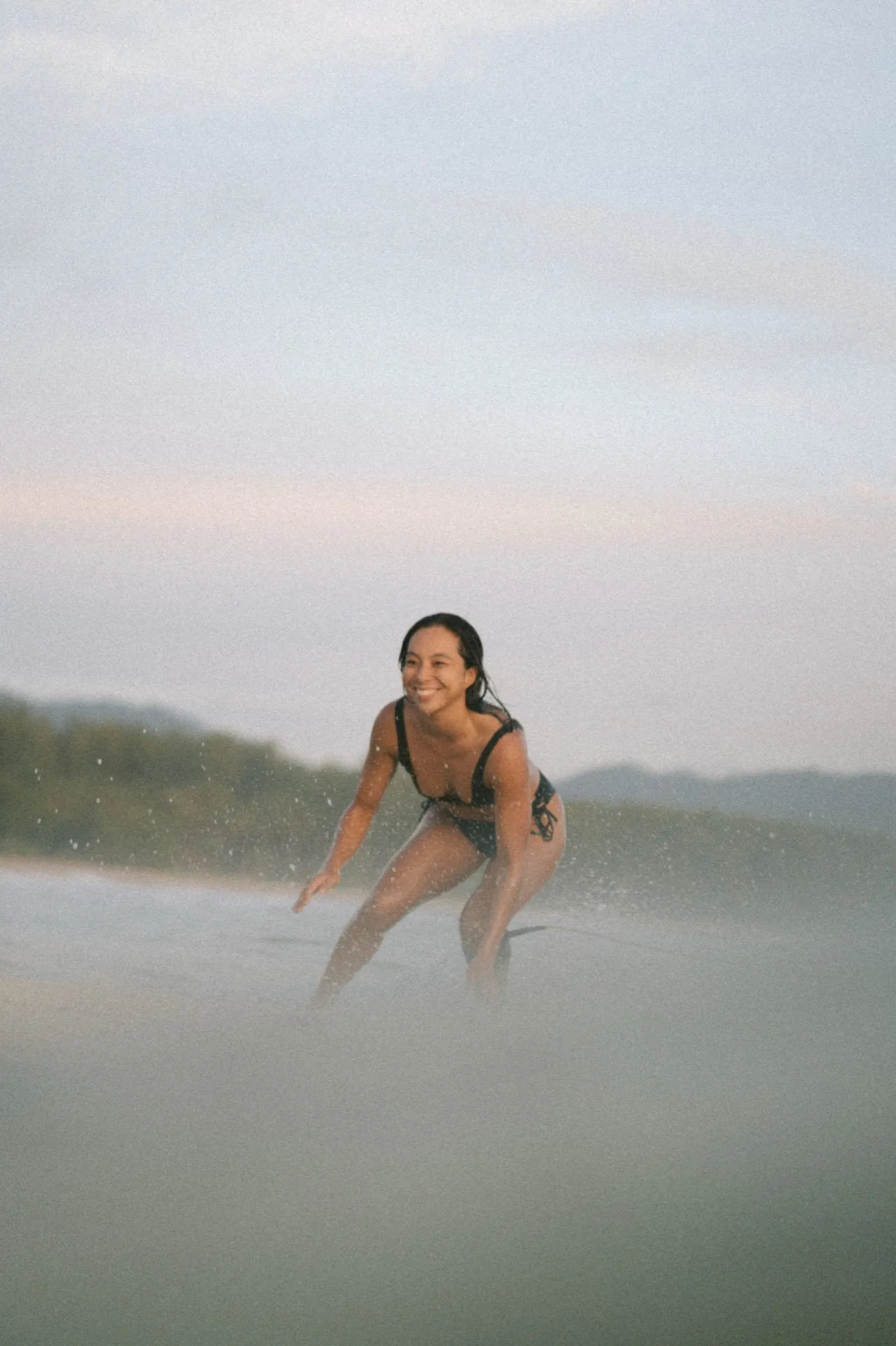 Surfers catching sunrise swell at Memories Beach Khaolak