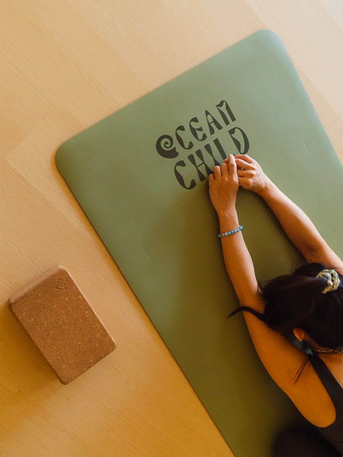 Child pose on Oceanchild studio yoga mat